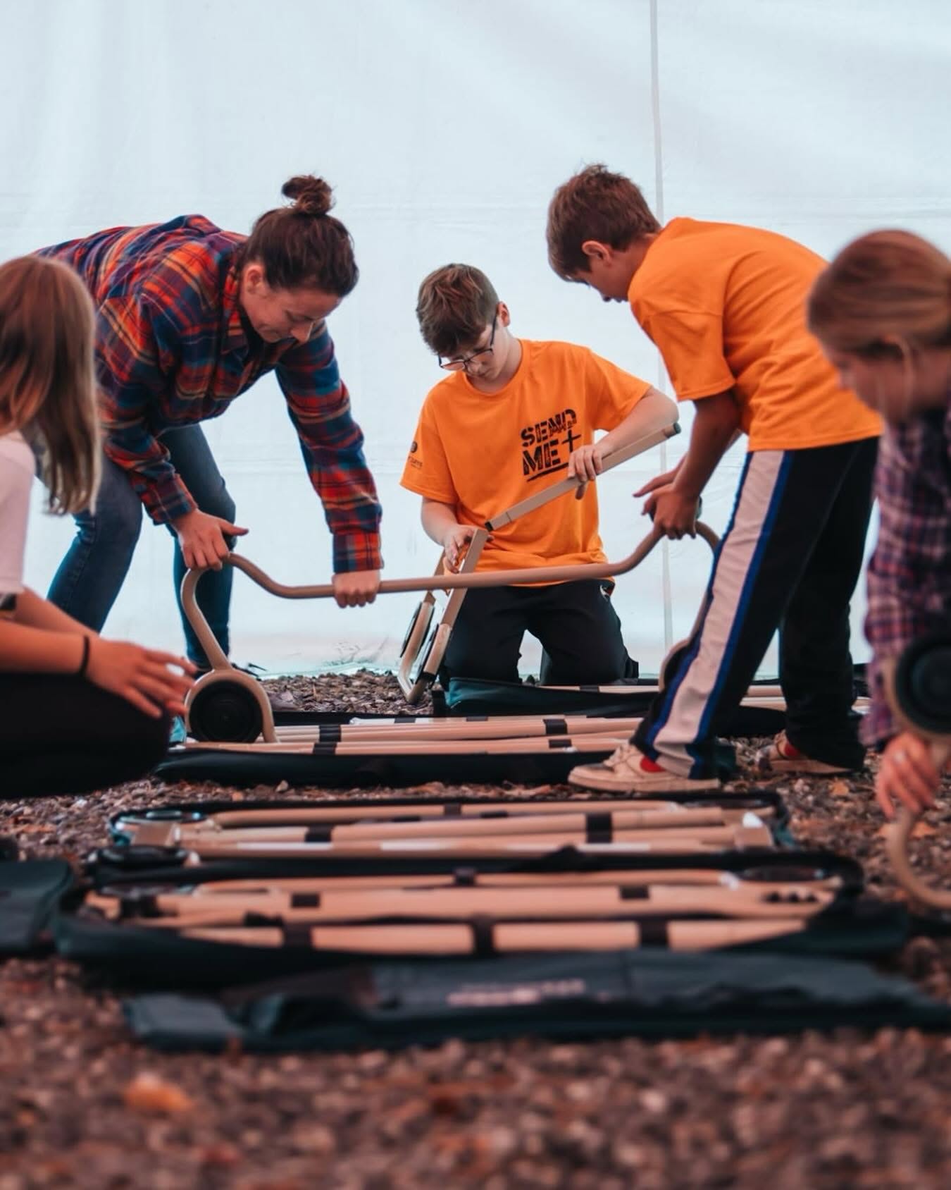 Volunteers assembling cots for families in need