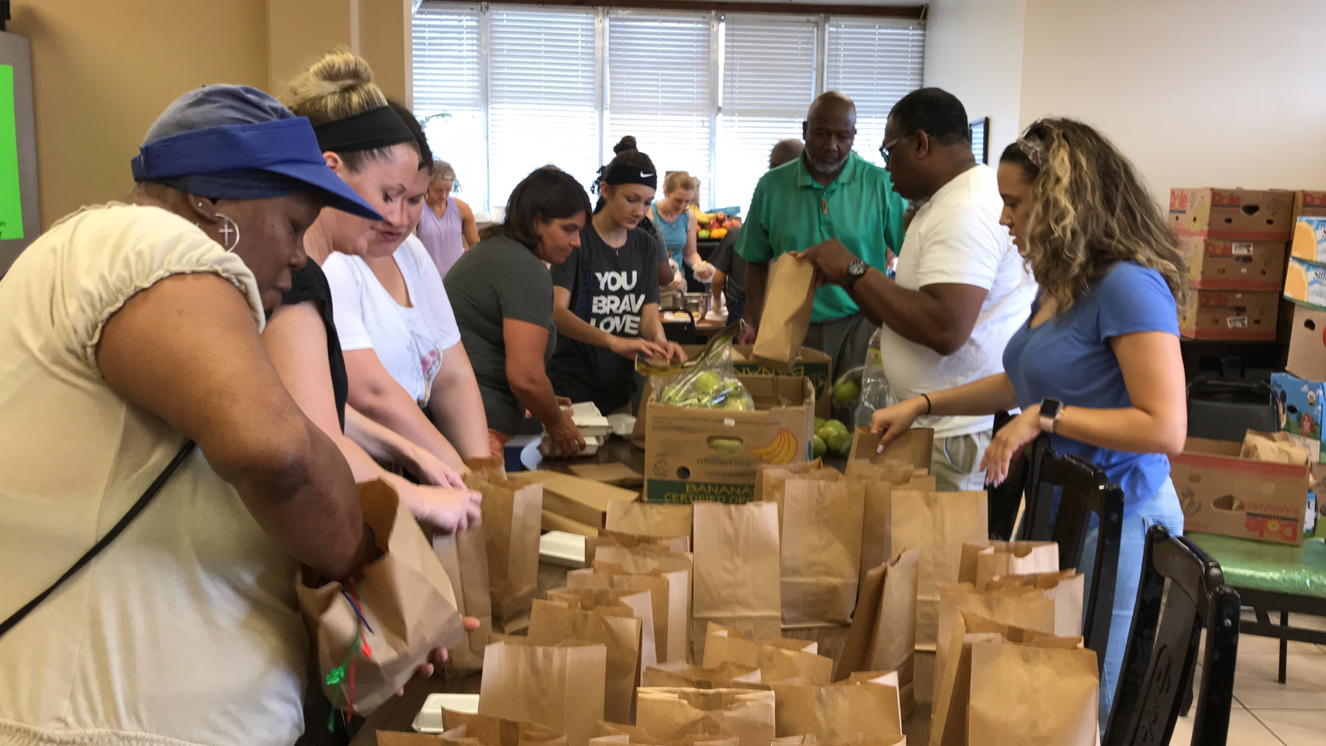 Adventures Relief volunteers packing food and supplies for the New Orleans community