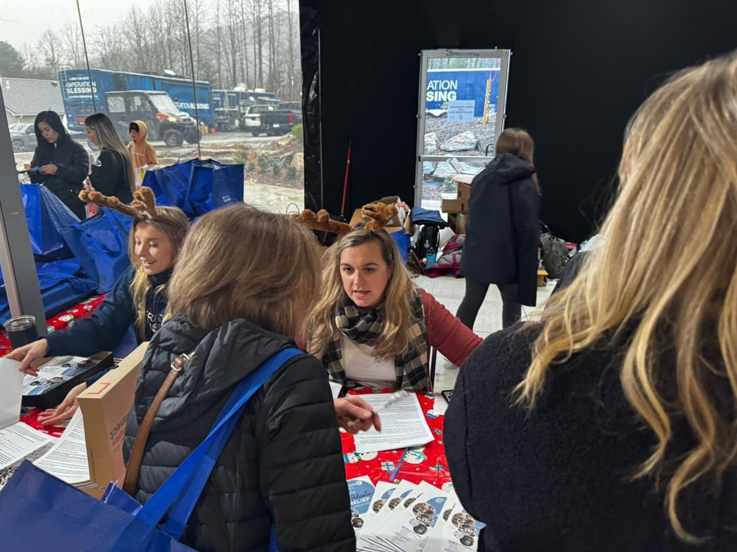 Volunteers serving families at a relief distribution event