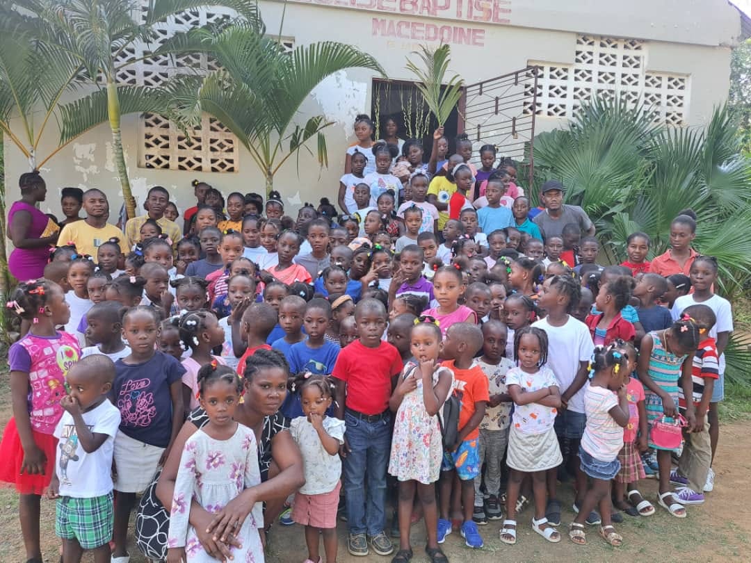 Children gathered outside the Labauye church school in Haiti supported by Adventures Relief
